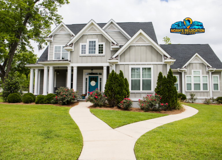 Professional residential movers in Aldie VA loading furniture from a large single-family home