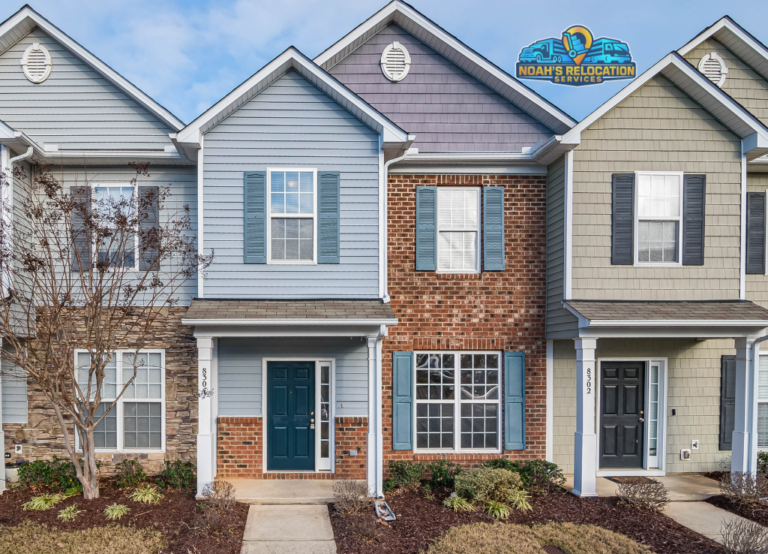 Professional residential movers in Purcellville VA loading furniture from a large single-family home